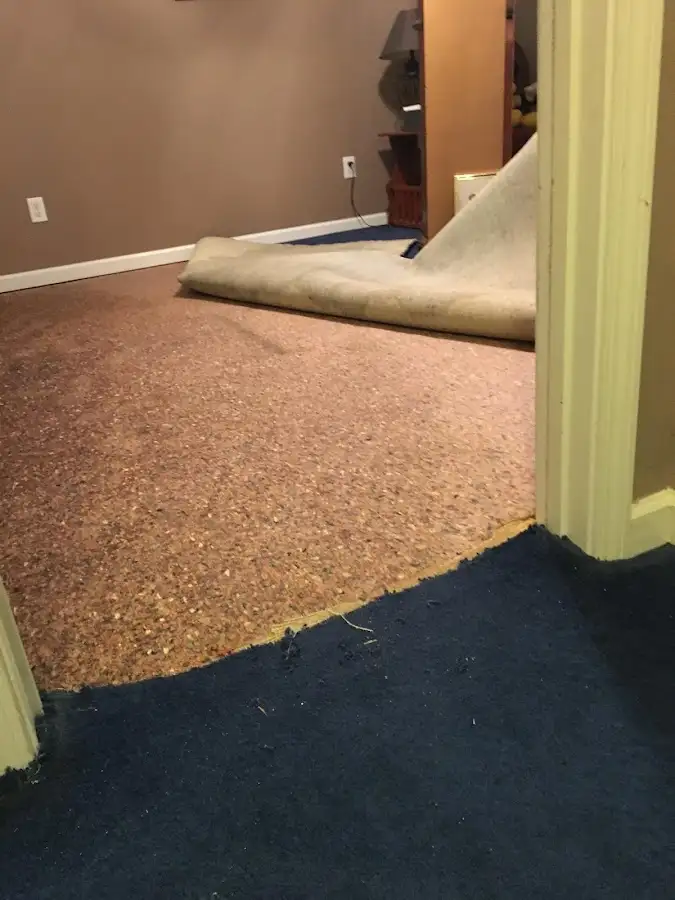 Carpet pad removal revealing water damage during Drying & Dehumidification in New Hartford